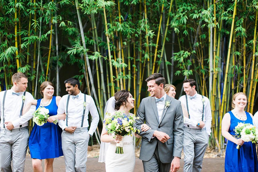 Wedding Bridal Portraits in Blue Bridesmaid Dresses in Bamboo Garden | White and Green Wedding Ceremony Decor with Exposed Brick Wall | St. Petersburg Wedding Venue NOVA 535 | Green and Blue Non Beach Florida Destination Wedding