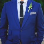Groom Wedding Portrait in Blue Suit with Checkered Pocket Square