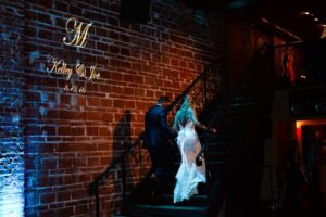 Unique Modern Downtown St. Pete Wedding Venue NOVA 535 with Brick Walls and Wrought Iron Staircase and Custom GOBO Lighting