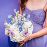 Bridesmaid Portrait Wearing Spaghetti Strap Dusty Purple Dessy Dress with Pastel Purple Rose, Light Blue Flower, White Hydrangea and Greenery Bouquet | Whimsical Purple and Blue Wedding at DTSP Historic Venue NOVA 535