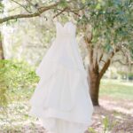 Strapless Ballgown Hayley Paige Wedding Dress on Hanger in Tree