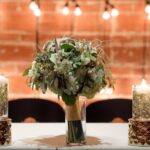Greenery floating candle centerpiece at sweetheart table