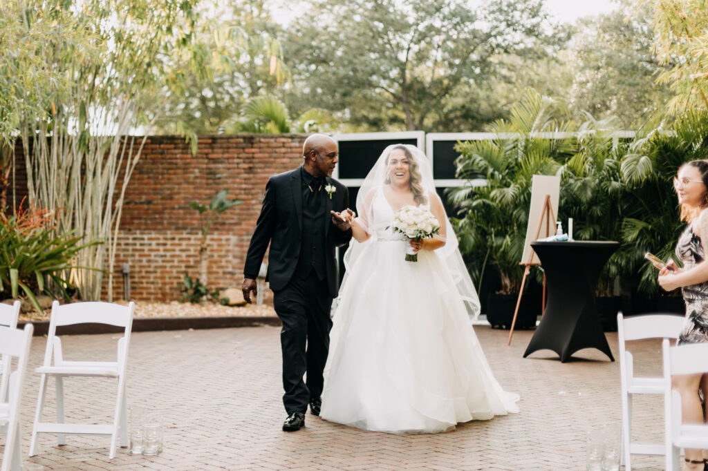 Bride and Father Walking Down Wedding Aisle