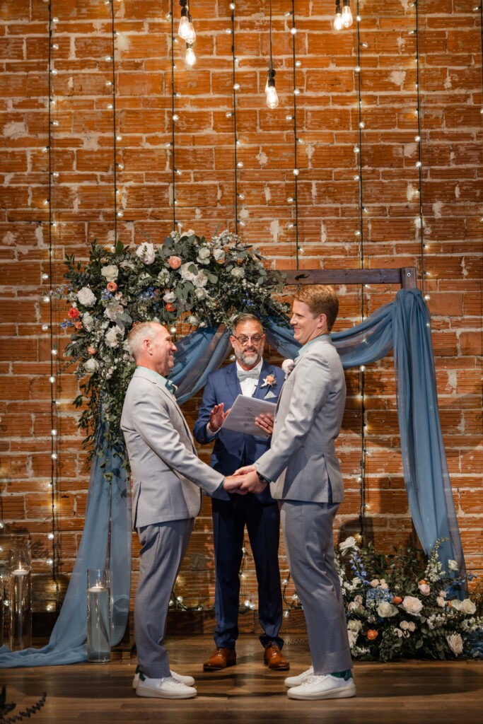 Same Sex Gay Wedding Ceremony Grooms Exchanging Vows