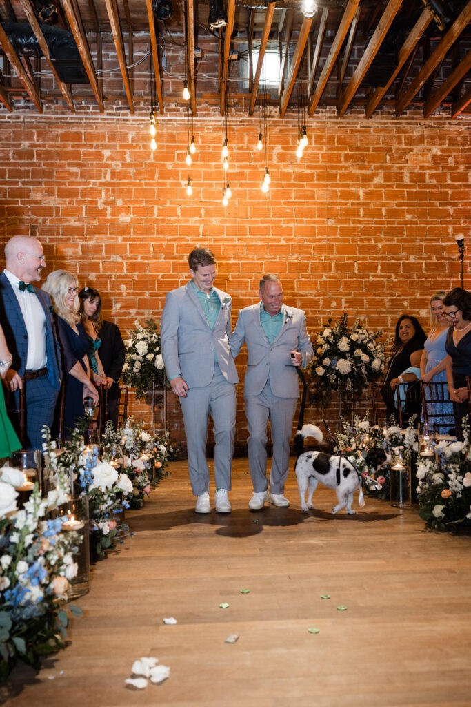 Same Sex Gay Wedding Grooms Walking Down the Aisle with Dog