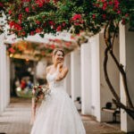Bride in strapless sweetheart neckline wedding dress Industrial chic wedding decor with jam favors at Historic Wedding Venue NOVA 535 in Tampa Bay
